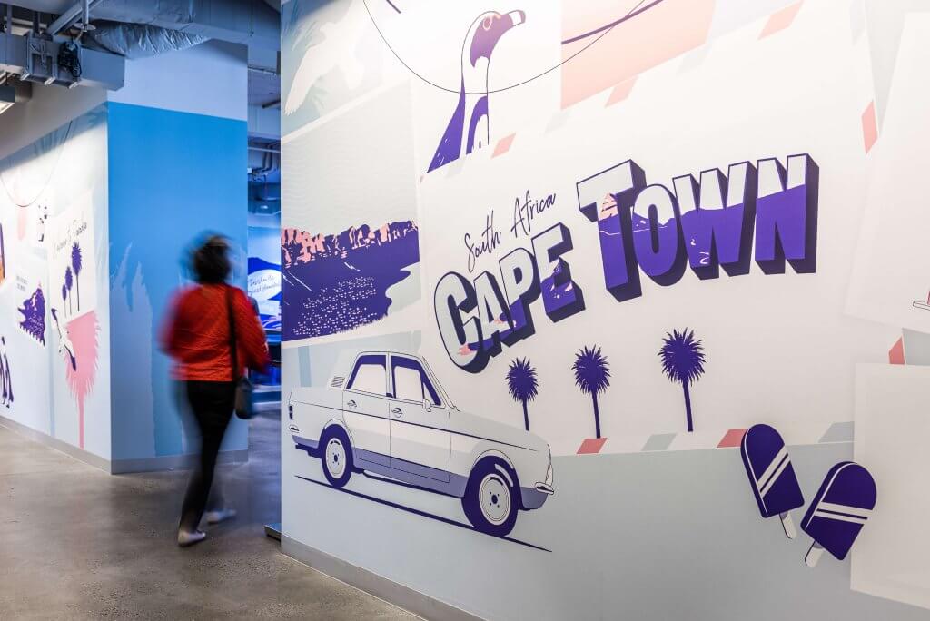 Wall graphics made up of super-sized Cape Town postcards. Text reads Cape Town, South Africa.